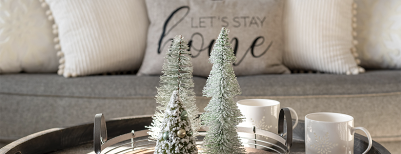 Holiday decor set up in front of couch