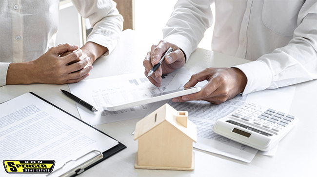 Working on papers with real estate agent